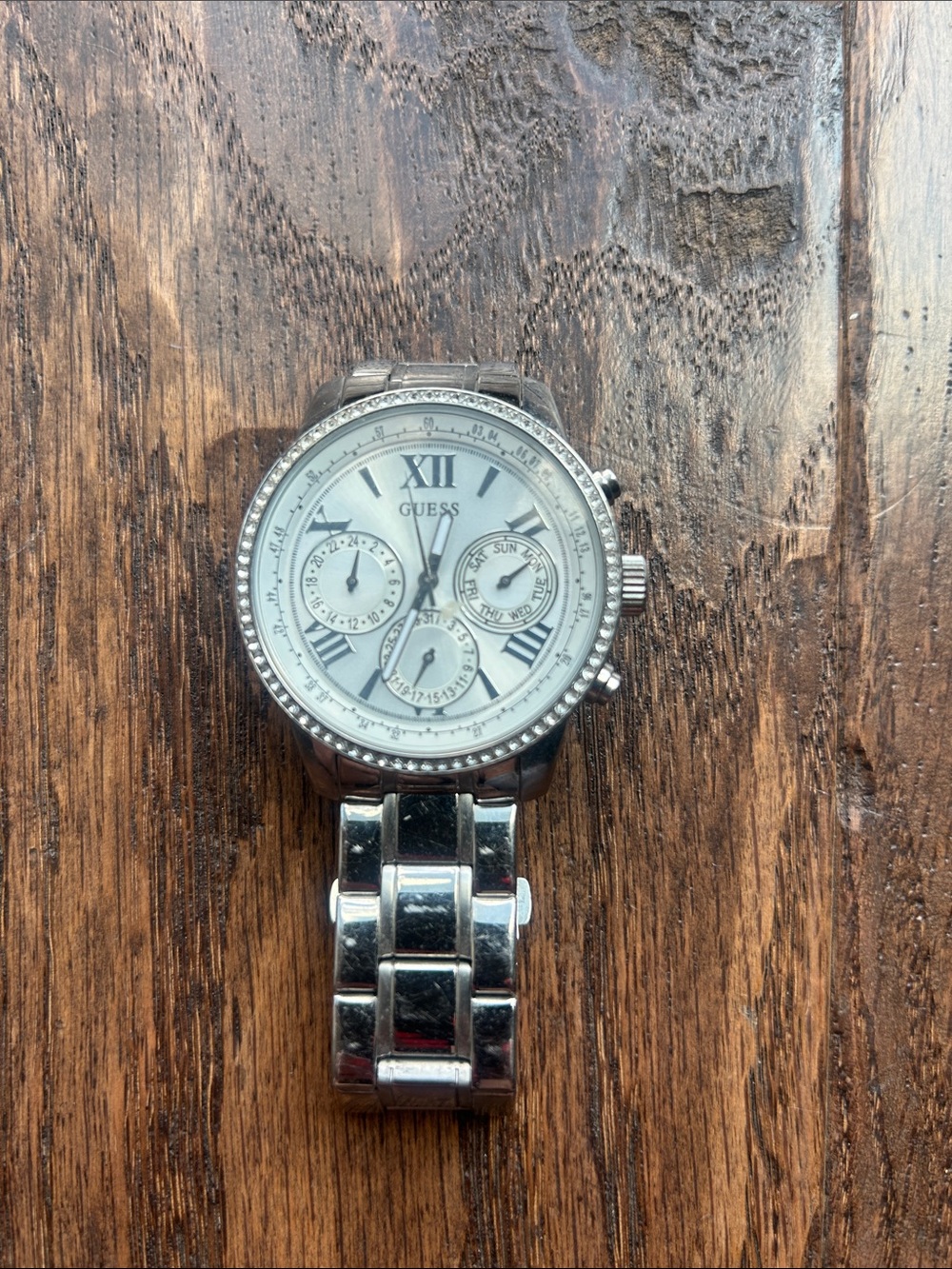 Guess Silver-Tone Crystal Bezel Watch with White Dial needs new battery